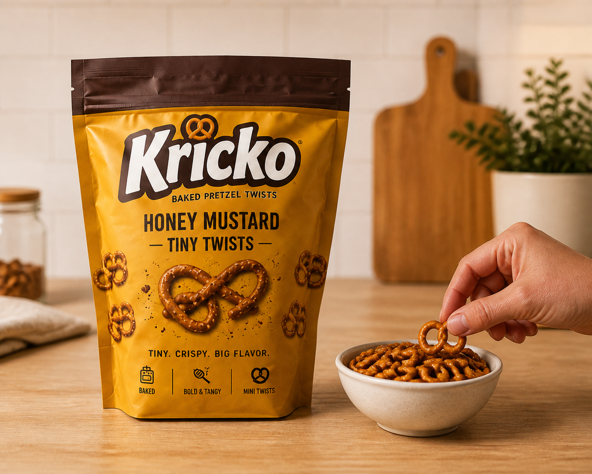 Kricko pouch beside a hand and snack bowl for scale.